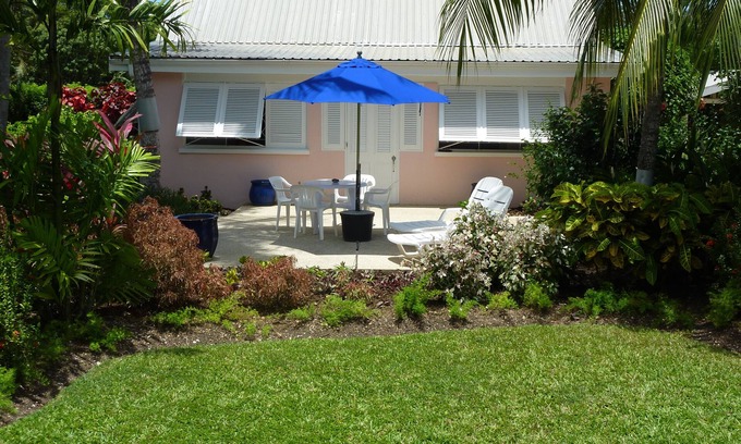 Gibbs Bay Cottage | Charming Garden Villa, 10/10 Guest Rated Near Beaches