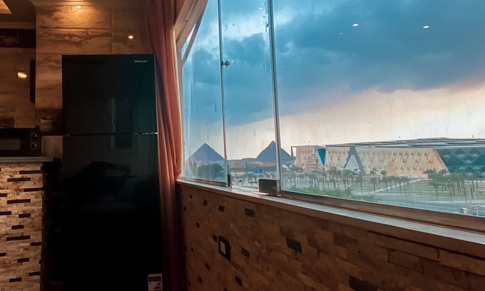 6th of October City House | Scenic Apartment with Pool and Pyramids View