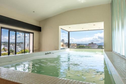 Villa Carlos Paz Apartment | Ideal Central Retreat with Pool and Ocean Views