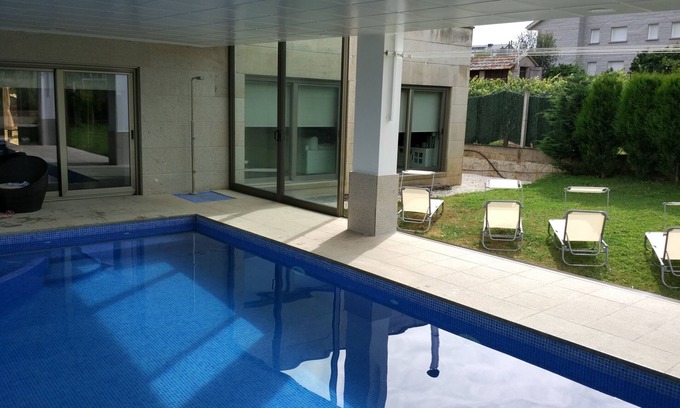 Sanxenxo Ski Chalet | Stylish Design House with Pool and Ocean View Amenities