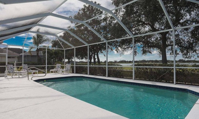 Regency Oaks House | Idyllic Lakefront Retreat with Private Pool at Regency Oaks