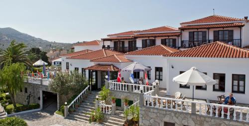 Skopelos Hotel | Beachfront Bliss at Dionyssos: Pool & Ocean Views Await