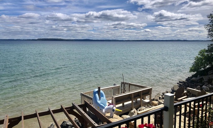Traverse City House | Prime Waterfront Retreat on West Bay with Pool & Firepit
