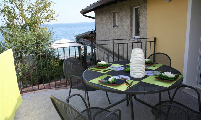 Moniga del Garda Apartment | Beachfront Retreat with Terrace and Lake Views Await You