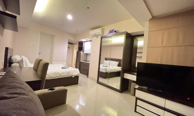 Pekayon Jaya Apartment | Cozy 1BR Retreat with Sofa Bed, WiFi & Pool Access