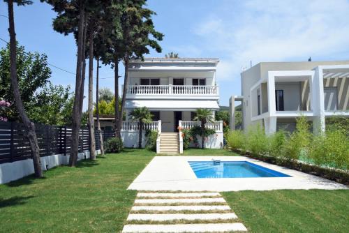Toroni Villa | Experience Divine Villa: Family-Friendly with Ocean Views