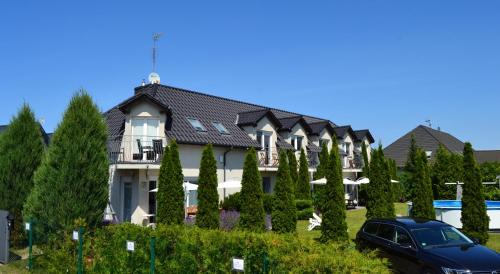 Dziwnowek House | Cozy Dom Aurora: Family-Friendly Rooms by the Sea
