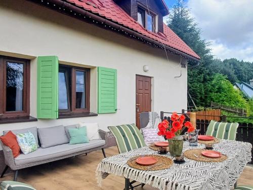 gmina Stary Dzierzgon House | Cozy Lakeview Retreat with Fireplace and Child-Friendly Amenities
