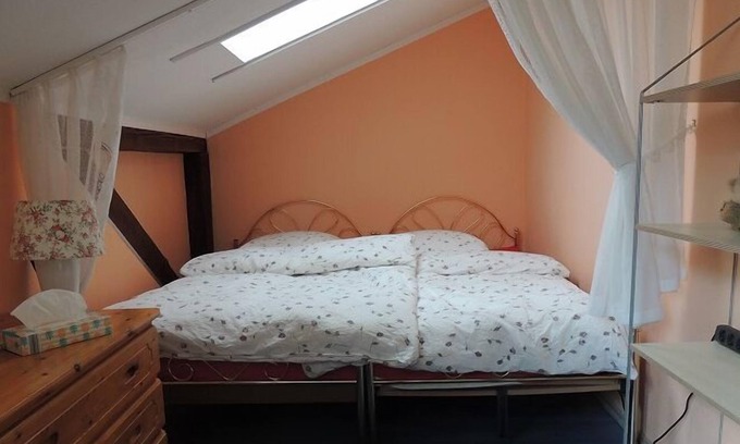 Oberaula Apartment | Relaxing Double Room with Sofa, Shared Facilities Await