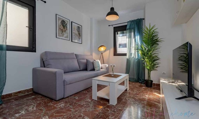 Huelva Apartment | Modern Two-Bedroom Retreat in Central Location with Garage
