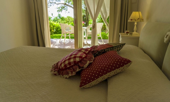 San Teodoro Apartment | Tranquil Double Room Surrounded by Lush Greenery