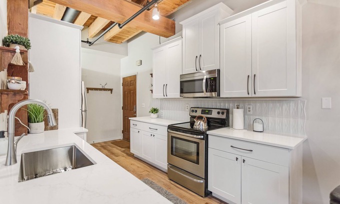 Grand Haven Condo | Downtown Water View with Private Balcony & Hot Tub
