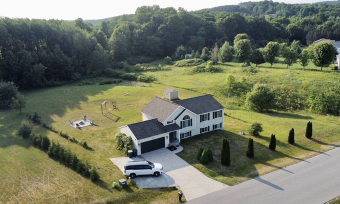 Traverse City House | Dream Palace: Hot Tub, Game Room & Fire Pit near Long Lake