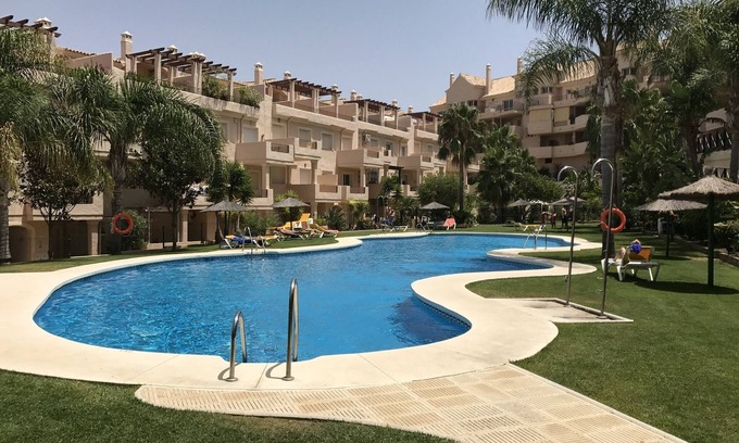 Castillo de Sabinillas Apartment | Family-Friendly Duguesa Fairways: Pool & Ocean Views Await