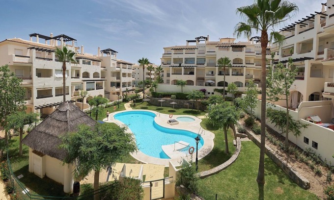 San Luis de Sabinillas Apartment | Discover Duquesa Sun: Poolside Relaxation & Ocean Views