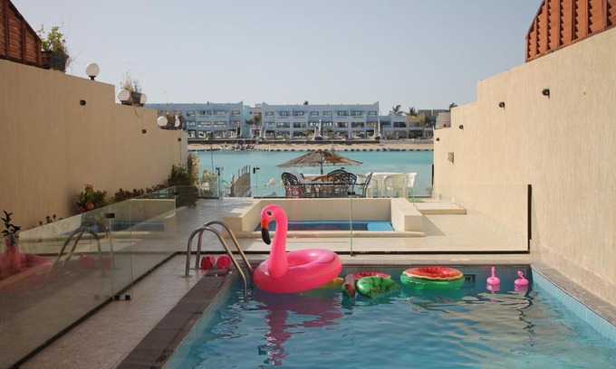 Durrat Al-Arous Ski Chalet | Relax at Rose Beach Villas with Oceanfront Pool Access