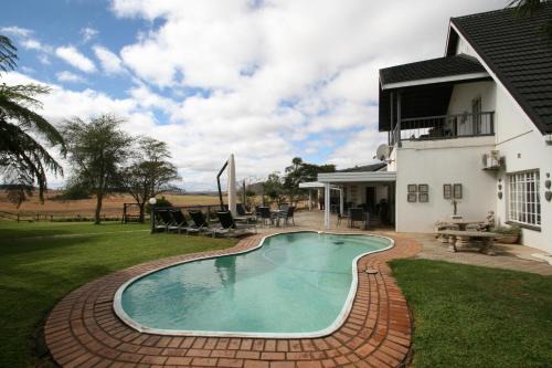 Piet Retief House | Discover Dusk to Dawn Guesthouse: 4-Star Family Retreat