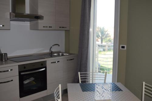 Agnone Bagni Apartment | Beachside Escape at Eclisse House with Oceanfront Views
