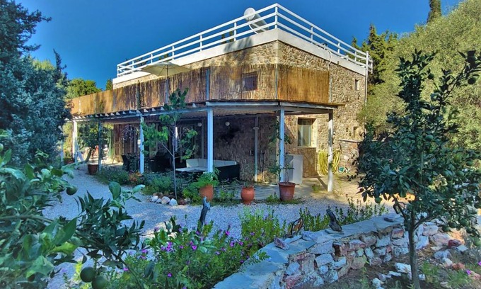 Mastichari House | Tranquil Eco Oasis: Hand-Built Stone House Retreat