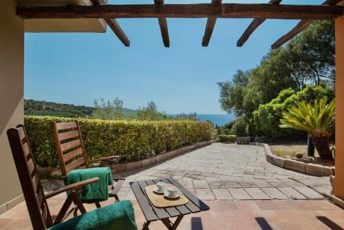Teulada Apartment | Relaxing Ecovillage with Pool and Private Outdoor Spaces