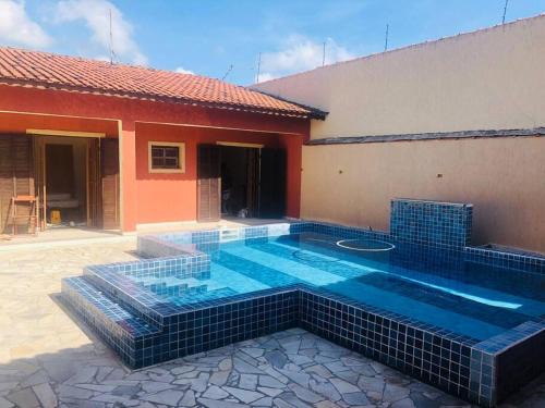 Mongagua Apartment | Elegant Oceanfront Guesthouse with Pool, Just Steps from Beach