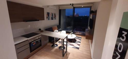 Asuncion Apartment | Discover Edificio Hassler Villamorra: Pool & Hot Tub Retreat