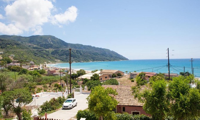 Agios Georgios Pagon Apartment | Experience Eleana Apartments with Oceanfront Views