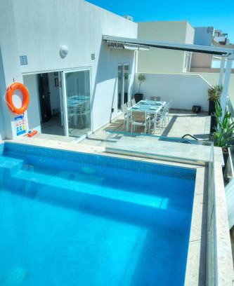 Tal-Ibrag Apartment | Stylish 2-Bedroom Retreat with Pool and Sunny Terrace
