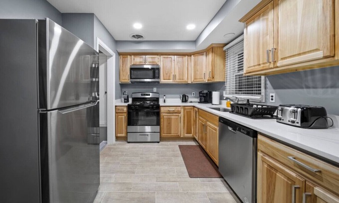 Shelby Township House | Elegant Oasis: Your 4-Bedroom Pet-Friendly Retreat