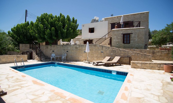 Goudi Apartment | Charming Elpida's Stone Houses with Pool & Family Amenities