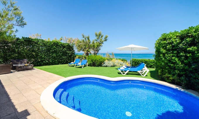 Urbanizacion S'Estanyol Villa | EMBAT: Seafront Retreat with Pool and Family Amenities