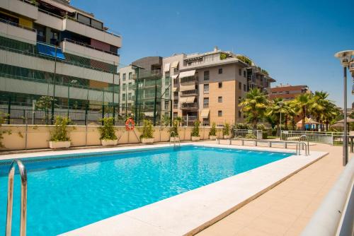 Figares Apartment | Indulge at EnjoyGranada: Pool, Parking & Ocean Views