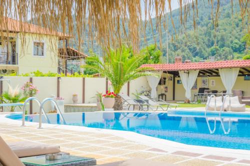 Chrisi Akti Apartment | Discover Eric's Apartment: Oceanfront Retreat with Pool