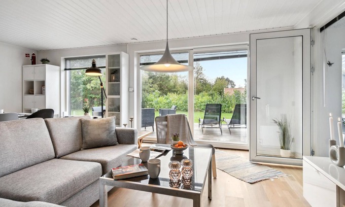Hojslev House | Relax in a Beautiful Wooden House with Lake Views & Spa