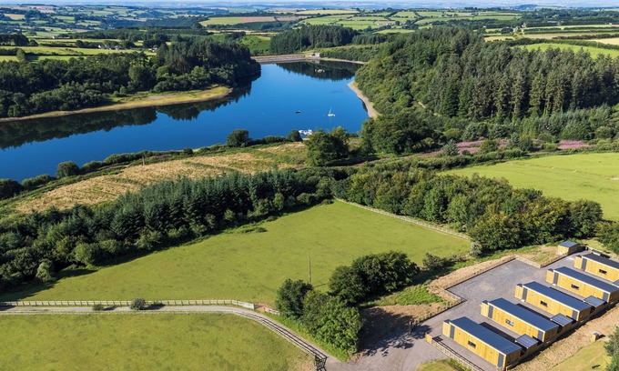 Brayford Cabin | Escape to nature - stunning group lodges overlooking Wistlandpound Reservoir