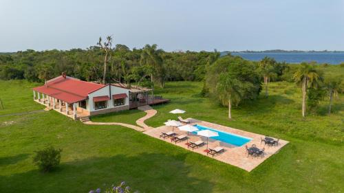 Colonia Carlos Pellegrini House | Discover Estancia Iberá: Family-Friendly with Pool & Dining