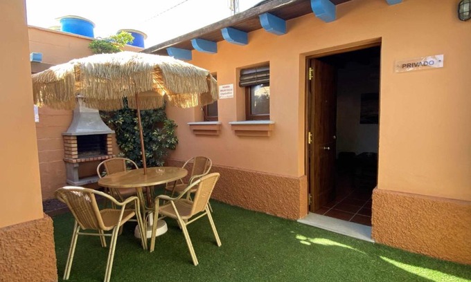 El Palmar Apartment | Cozy Studio with Private Garden, Barbecue & Pool Access