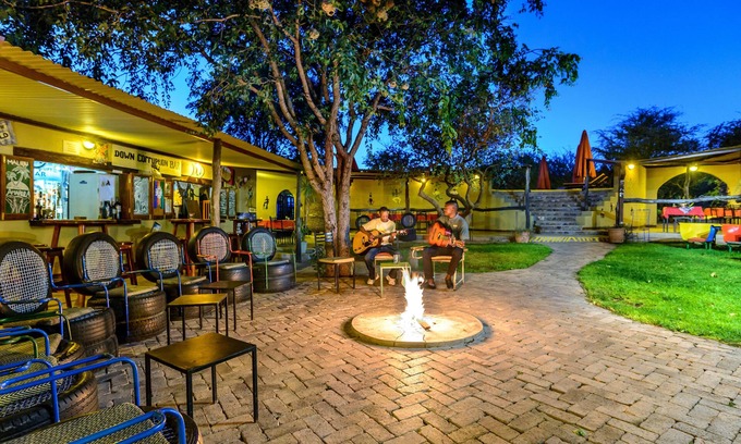 Okaukuejo Cabin | Explore Etosha Safari Camp: Family-Friendly Retreat with Pool