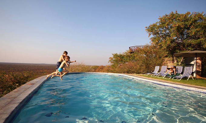 Okaukuejo Cabin | Experience Etosha Safari Lodge: Family-Friendly Retreat
