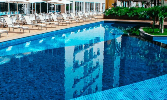 Bandeirantes Apartment | Relaxing Evian Thermas Residence with Pool & Ocean Views
