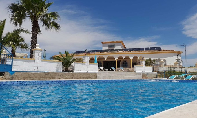Lora Del Rio Ski Chalet | Elegant Chalet with Pool and Spa near Sevilla for 14 Guests