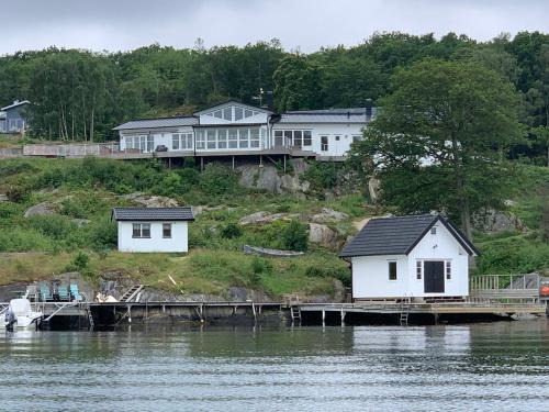Nosund Villa | Exclusive House with Private Boathouse & Ocean Views