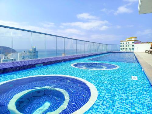 El Rodadero Apartment | Discover Ambar Roca: Exclusive Suites with Pool & Hot Tub