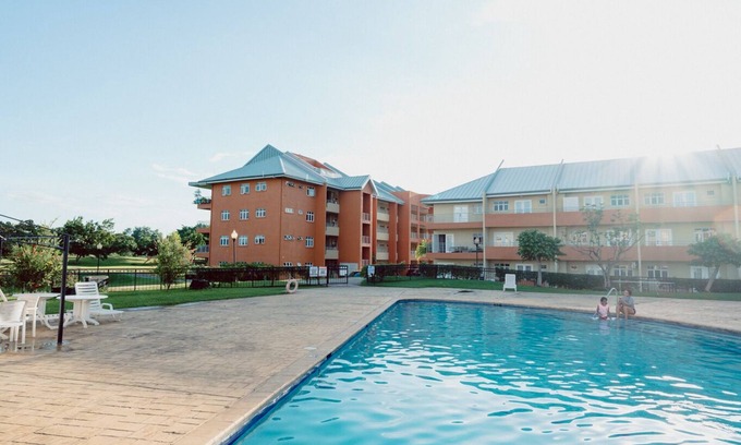 Arouca Condo | Elegant Three Bedroom Condo with Pool on the Golf Course