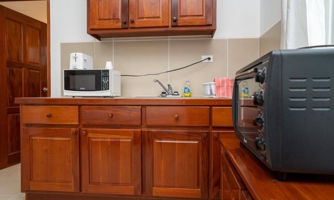Caye Caulker Apartment | Picturesque Poolside Retreat with Spa and Family Amenities
