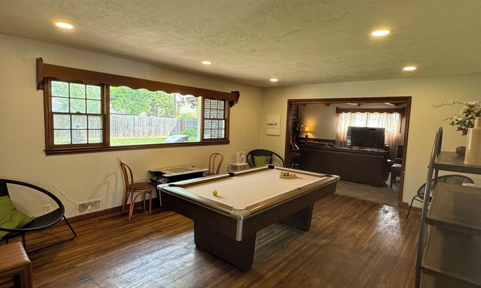 Wichita House | Inviting Retreat with Pool Table, Fire Pit & Arcade Games