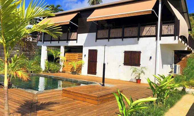 Tartane House | F3 Hibiscus: Ocean View, Pool & Family-Friendly Retreat