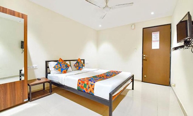 Surat Hotel | Comfortable FabHotel Happy Rooms with Breakfast & Accessibility