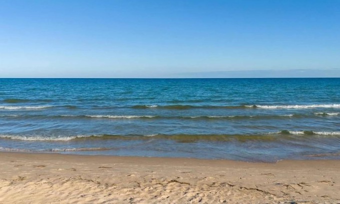 Jacksonport Cottage | Cozy Little White Cottage by Lake Michigan's Sandy Beach