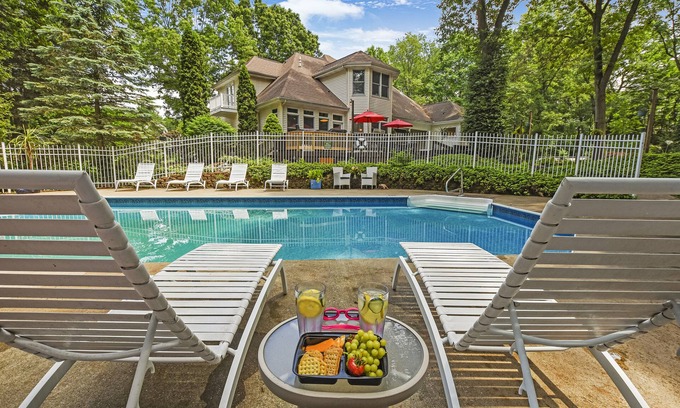 Battle Creek House | Experience Paradise Gardens: Game Room, Pool & Hot Tub!